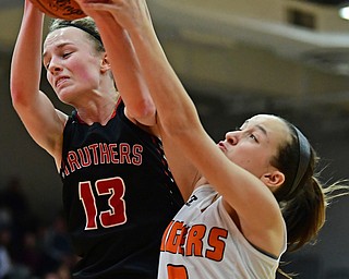 AUSTINTOWN, OHIO - FEBRUARY 26, 2018: Struthers' Alexis Bury, left, and Howland's Maria Dellimuti fight for a rebound during the second half of their OHSAA district tournament game at Fitch High School. Howland won 35-24. DAVID DERMER | THE VINDICATOR