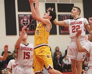 William D. Lewis The Vindicator Mooney's Mark Phillips(4) shoots past Girard's Mark Waid(15) and Christian Graziano(22).).