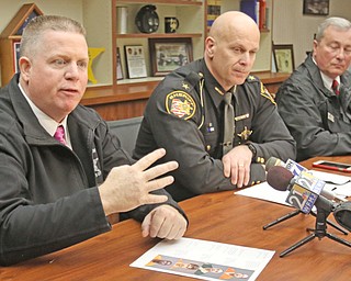 Maj. Jeff Allen of the Mahoning County Sheriff’s office, left, Sheriff Jerry Greene and Bureau of Criminal Investigation special agent James Ciotti talk about the investigation that led to the arrests of 10 men this week, who face charges of attempting to solicit sex from minors.