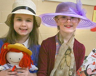 Sophia Reed, left, and Natalie Anderson, both first graders at Canfield Hilltop Elementary, dress as characters from their favorite books. Both Hilltop and C.H. Campbell are celebrating Right to Read Week this week with a new activity for students every day. 