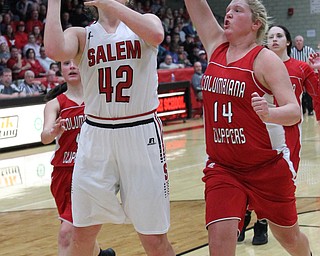 Salem's Kyla Jamison (42) goes up for a shot while being defended by Columbiana's Marisa McDonough (14) during  the second half of Wednesday nights matchup at Struthers High School.  Dustin Livesay  |  The Vindicator  2/28/18  Struthers
