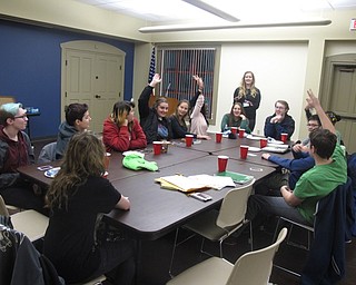 Neighbors | Zack Shively.The TAB meeting included food and drinks, a discussion about what they have read in the last month and a game. The help plan the library's young adult reading recommendations. Pictured, the group plays a game called "Werewolf."