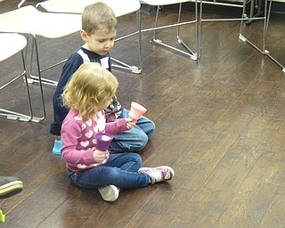 Neighbors | Zack Shively.The Baby Brilliant: Tales and Talk for 2s and 3s program aims to raise literacy skills in young children through stories and songs. Pictured, children Audrey and James shake bells while singing "Brother John."