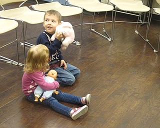 Neighbors | Zack Shively.Karen Saunders gave the children toys for some of their activities. The children passed around a baby doll during "Here is the Baby" by Polly Kanevsky and Taeeun Yoo, cradled a baby doll and stuffed animal during "Rock A-Bye Baby" and played with bells during "Brother John."