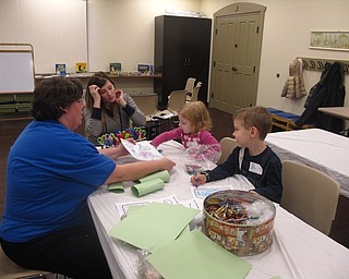 Neighbors | Zack Shively.James and Audrey made a craft relating to a story Karen Saunders read earlier in the program called, "The Napping House." The craft worked the children's creative and motor skills as they had to color and cut out the pieces of paper.