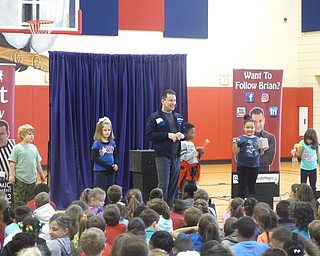 Neighbors | Zack Shively.Performer Brian Richards invited five students to the front to help him explain how different fruits and vegetables help our bodies, such as carrots helping eyesight.