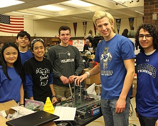 Neighbors | Abby Slanker.Poland Seminary High School Robotics team members Diego Calderon, Mum Masaki, Margaret Faur, Marik Rogenski, Sammy Dwyer and Charisma Ojeda worked on their robots during a break on the competition at the VEX Regional Robotics Competition on Feb. 3.