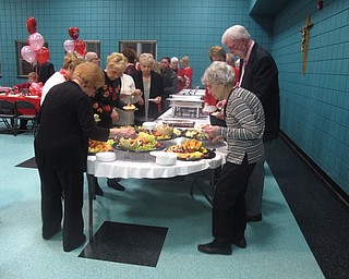 Neighbors | Zack Shively.The food for the Valentine's Day Dinner included cheese, crackers and a fruit tray for appetizers; chicken, pasta, salad, and rolls for dinner; and chocolate mousse for dessert.