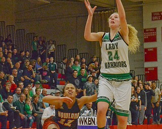 Scott Williams - The Vindicator - West Branch's Sarrah Tennefoss (#24) takes a shot as Howland's Ka'Rina Mallory (#12) takes a spill at their playoff game at Austintown Fitch on Thursday March 1, 2018.