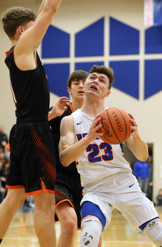 BERLIN CENTER, OHIO - MARCH 2, 2018: Western Reserve's Cole DeZee (23) drives to the hoop against Springfield's Evan Ohlin (1) during the 2nd qtr at Western Reserve High School.  MICHAEL G. TAYLOR | THE VINDICATOR