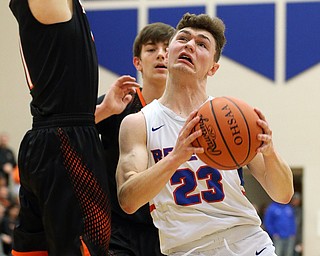 BERLIN CENTER, OHIO - MARCH 2, 2018: Western Reserve's Cole DeZee (23) drives to the hoop against Springfield's Evan Ohlin (1) during the 2nd qtr at Western Reserve High School.  MICHAEL G. TAYLOR | THE VINDICATOR