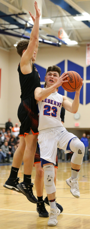 BERLIN CENTER, OHIO - MARCH 2, 2018: Western Reserve's Cole DeZee (23) drives to the hoop against Springfield's Evan Ohlin (1) during the 2nd qtr at Western Reserve High School.  MICHAEL G. TAYLOR | THE VINDICATOR