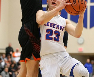 BERLIN CENTER, OHIO - MARCH 2, 2018: Western Reserve's Cole DeZee (23) drives to the hoop against Springfield's Evan Ohlin (1) during the 2nd qtr at Western Reserve High School.  MICHAEL G. TAYLOR | THE VINDICATOR