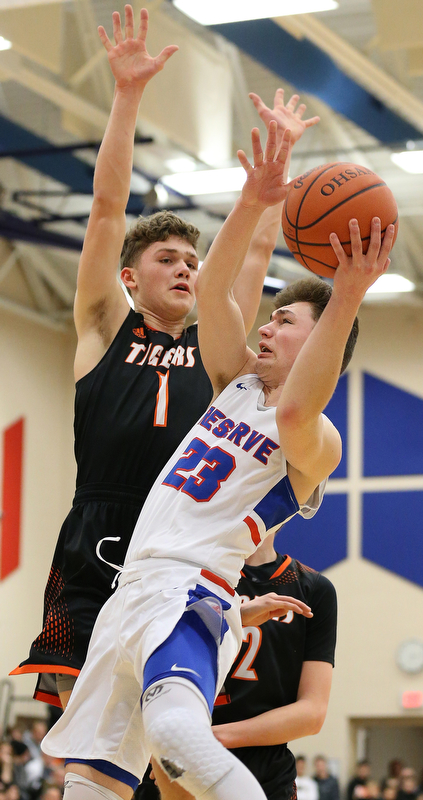 BERLIN CENTER, OHIO - MARCH 2, 2018: Western Reserve's Cole DeZee (23) drives to the hoop against Springfield's Evan Ohlin (1) during the 2nd qtr at Western Reserve High School.  MICHAEL G. TAYLOR | THE VINDICATOR