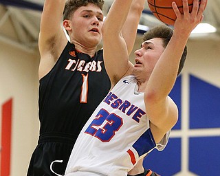 BERLIN CENTER, OHIO - MARCH 2, 2018: Western Reserve's Cole DeZee (23) drives to the hoop against Springfield's Evan Ohlin (1) during the 2nd qtr at Western Reserve High School.  MICHAEL G. TAYLOR | THE VINDICATOR