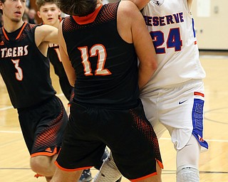 BERLIN CENTER, OHIO - MARCH 2, 2018:  Western Reserve's Kade Hilles (24) drives to the hoop against  Springfield's Shane Eynon (12) the 2nd qtr at Western Reserve High School.  MICHAEL G. TAYLOR | THE VINDICATOR