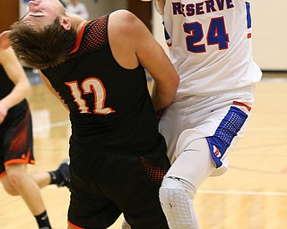 BERLIN CENTER, OHIO - MARCH 2, 2018:  Western Reserve's Kade Hilles (24) drives to the hoop against  Springfield's Shane Eynon (12) the 2nd qtr at Western Reserve High School.  MICHAEL G. TAYLOR | THE VINDICATOR