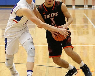 BERLIN CENTER, OHIO - MARCH 2, 2018:  Western Reserve's Kade Hilles (24) defends by Springfield's Brandon Walters (3) the 3rd qtr at Western Reserve High School.  MICHAEL G. TAYLOR | THE VINDICATOR