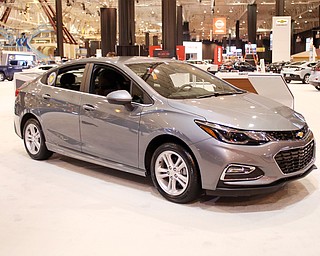 A 2018 Chevy Cruze Sedan sits on display during the annual Cleveland Car Show, Friday, Feb. 23, 2018, at the IX Center in Cleveland...(Nikos Frazier | The Vindicator)