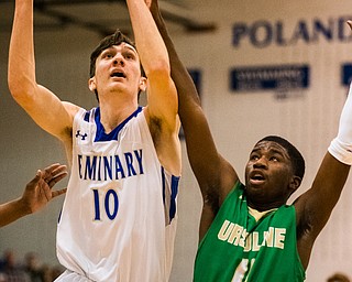 Poland's Dan Kramer gets past Ursuline defender RJ Clark on the way to the basket during sectional tournament action in Poland on Friday night. Poland won 68-47...Photo by Dianna Oatridge