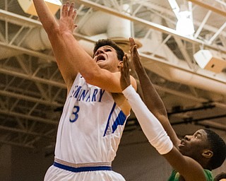 Poland's Braeden O'Shaughnessy goes to the basket past Ursuline defender RJ Clark during Poland's 68-47 sectional tournament win in Poland on Friday night...Photo by Dianna Oatridge