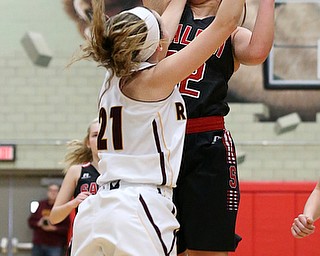 STRUTHERS, OHIO - MARCH 3, 2018: Salem's Allee Davidson-Chuck (22) is fouled as she shoots against South Range's Samantha Patrone (21) during the 2nd qtr at Struthers High School, Struthers' Fieldhouse. MICHAEL G. TAYLOR | THE VINDICATOR