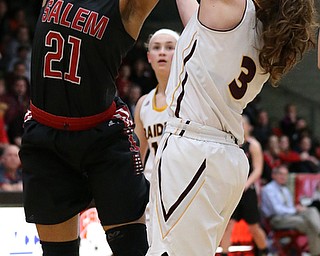 STRUTHERS, OHIO - MARCH 3, 2018:  Salem's Echo Mayer-Kutz (21) has her shot blocked by South Range's Izzy Lamparty (3) during the 2nd qtr at Struthers High School, Struthers' Fieldhouse.  MICHAEL G. TAYLOR | THE VINDICATOR