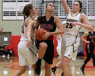 STRUTHERS, OHIO - MARCH 3, 2018: Salem's Ellie Davidson (12) drives to the hopp between South Range's Maddie Durkin (13)(left) and Dani Vuletich (25) during the 3rd qtr at Struthers High School, Struthers' Fieldhouse. MICHAEL G. TAYLOR | THE VINDICATOR