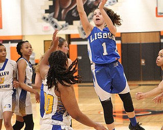 Lisbon's Izzy Perez (1) puts up a jump shot over Valley Christian's Taylor Jones (00) during the second half of Saturday afternoons championship matchup at Mineral Ridge. Dustin Livesay | The Vindicator 3/3/18 Mineral Ridge.