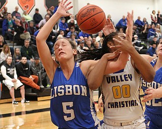 Lisbon's Chloe Smith (5) fights for a rebound with Valley Christian's Taylor Jones (00) during the second half of Saturday afternoons championship matchup at Mineral Ridge. Dustin Livesay | The Vindicator 3/3/18 Mineral Ridge.