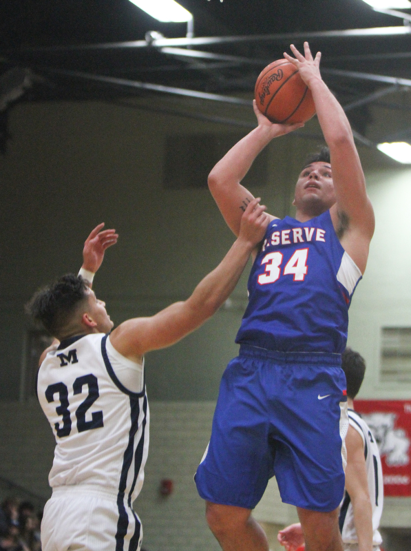 William D. Lewis The Vindicator   Western Reserve's Jack Cappabianca(34) shoots past McDonald'sRyan Scala(22).