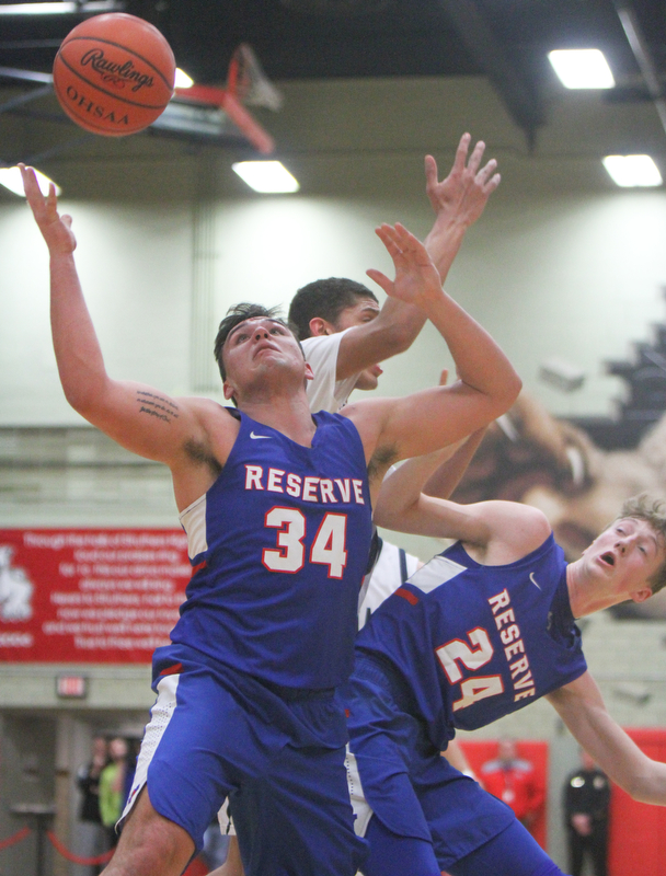 William D Lewis The Vindicator  W.Reserve's Jack Cappabianca(34) and Kade Hilles(24) go for a rebound.