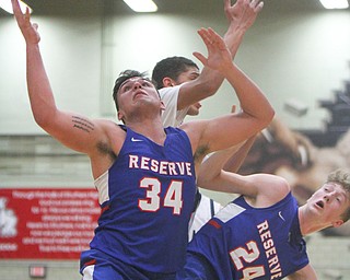 William D Lewis The Vindicator  W.Reserve's Jack Cappabianca(34) and Kade Hilles(24) go for a rebound.