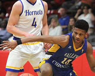 William D. Lewis The Vindicator  Valley'sJordan Trowers(15) drives around East Canton's  Anthony Baad(4) during 3-6-18 action in Struthers.