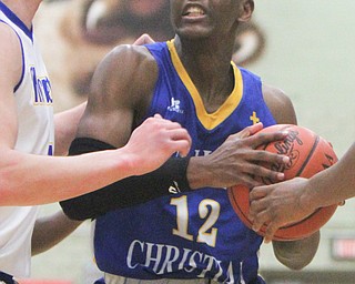 William D. Lewis The Vindicator  Valley'sJMelvin Neail(12) drives around East Canton's Anthony Baad(4) during 3-6-18 action in Struthers.