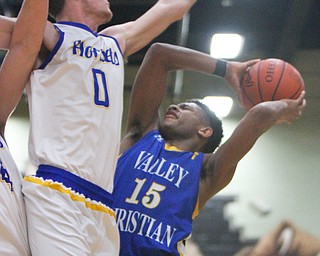 William D. Lewis The Vindicator  Valley'sJordan Trowers(15) is stopped by East Cantons Emmanuel Armour(0)) during 3-6-18 action in Struthers.