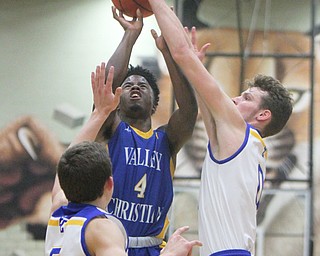 William D. Lewis The Vindicator  Valley'sJamynk Jackson(4) shoots around East Canton'sJoey Knopp(5) and Damian clark(0)(4) during 3-6-18 action in Struthers.