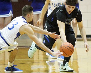 William D. Lewis The Vindicator Poland's Brandon Barringer(13) and Lakeview'sDrew Munno(22)) during 3-7-18 action at Boardman.