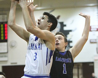 William D. Lewis The Vindicator Poland's Braeden O'Shaungnessey(3) shoots past  Lakeview'sDaniel Evans(1) during 3-7-18 action at Boardman.