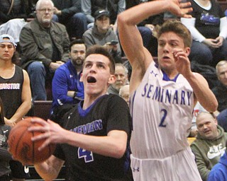 William D. Lewis The Vindicator Lakeview's TJ Lynch(4) shoots past Poland'sMike Diaz(2) during 3-7-18 action at Boardman.