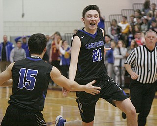 William D. Lewis The Vindicator Lakeview 's Jeff Remick(21) celebrates after defeating Poland 3-7-18  at Boardman. At left is Lakeview's Andrew Oakes(15).