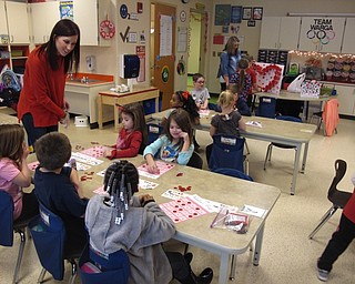 Neighbors | Zack Shively.The students at Austintown Elementary School particpated in games and made crafts during Valentine's Day. Pictured, Kristina Warga played bingo with her kindergarten class.