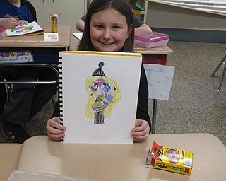 Neighbors | Zack Shively.The Butler's Good Neighbors program teaches children about art through activities and field trips. The students take a pre-test and a post-test before and after the program. During the program the children take two field trips to the Butler Institute of American Art and have lessons about different art styles. Pictured, Dobbins student Ava Day demonstrated what she learned about abstract art through her own drawing.