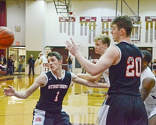 Isaiah Torreance (#1) and Ryan Leonard (#20) of Struthers reach out for the ball during their Thursday, March 8, 2018 game at Boardman High School...Photo by Scott Williams - The Vindicator.