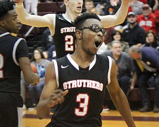 William D. Lewis The Vindicator Struther's Kevin Traylor(3) and Ryan Leonard(20) react after defeating Howland   3-8-18  at Boardman.