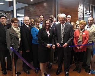 Neighbors | Zack Shively.The Michael Kusalaba branch of the PLYMC had a dedication ceremony on Feb. 24. The event featured a science display, a dedication, a ribbon cutting and a musical performance. Pictured, Library Executive Director Aimee Fifarek and President of the Library Board of Trustees David Ritchie cut the ribbon for the library.