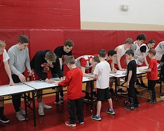 Neighbors | Abby Slanker.Canfield High School varsity basketball players autographed team pictures for the youth players of the Courtside Cardinals at the Courtside Open House on Feb. 26.