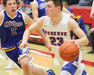 William D. Lewis the Vindicator  WR's Cole DeZee(23) drives aroundEast Canton's Joey Knopp(5) at Struthers 3-9-18.