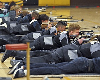 In this March 2, 2018 photo, a group of JROTC shooters compete in the prone position during the 2018 New Mexico Junior Olympic Qualifier for sport and precision air rifles at Cibola High School in Albuquerque, N.M., for the chance to compete at the National Junior Olympic Championships in Ohio in June. The National Rifle Association has given more than $7 million in grants to hundreds of U.S. schools in recent years, typically used for JROTC programs, including $126,000 given to Albuquerque schools. 