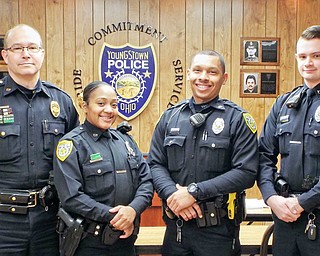 Youngstown police officers, from left, Detective Sgt. George Anderson, Jeshaila Dunkle, Michael Sarveko and John O’Neill Jr. are credited with saving a man who was having a heart attack Feb. 25 in his West Side home. 